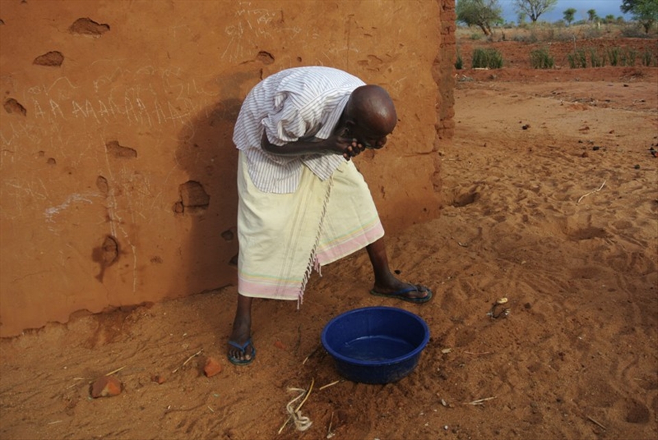Joseph Mbai, a cassava farmer in Eastern Kenya about to start his day