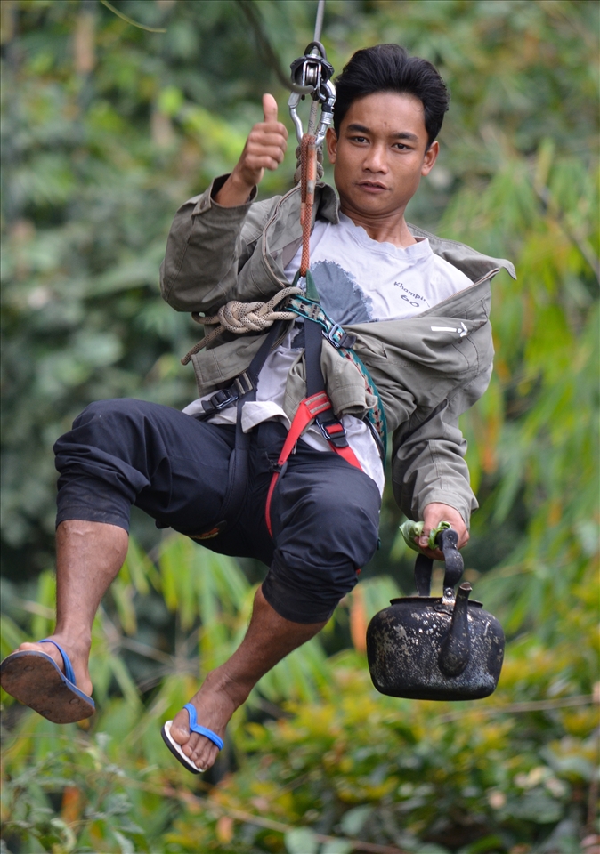 One of the most exhilarating experiences you can have. The Gibbon Experence in Laos. After a 5 minute demonstration, you find yourself ziplining 500m between valleys and hundreds of metres above ground - with the most basic of breaking systems.. an old bike tire placed on the line which you apply pressure to slow yourself down - pure adrenaline!  

This picture is of our guide zipping in to deliver us our morning coffee to our treehouse!