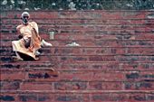 An ascetic man rests on steps lining the river Ganges. Such men live a life of severe self-discipline and abstention from all forms of indulgence.: by joecyriac, Views[391]