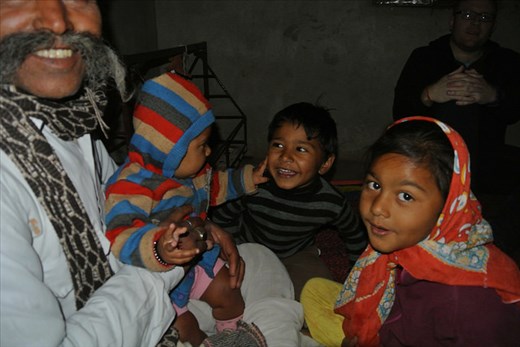 It's  a family affair - Village elder and grandchildren