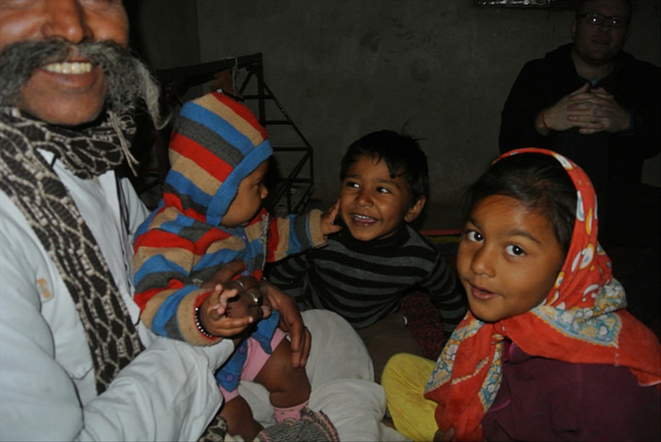 It's  a family affair - Village elder and grandchildren