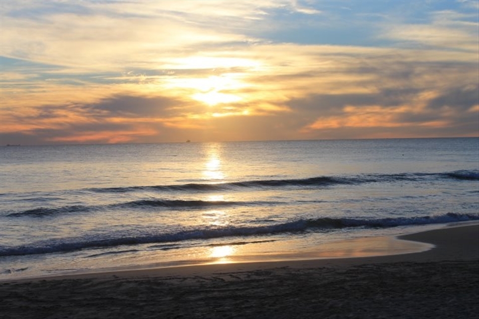 Sunset Glory: Picture seen with the Sun settling down behind curtains of clouds yet radiating strong rays of lights. This shows there will always be light and hope regardless of situation.