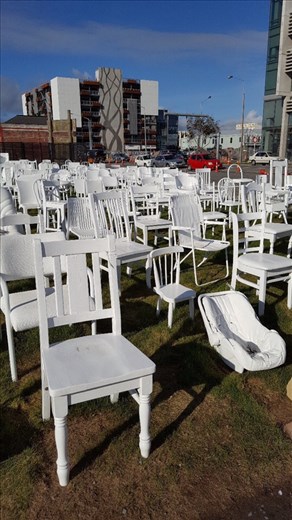 185 white chairs represent lives lost in earthquake