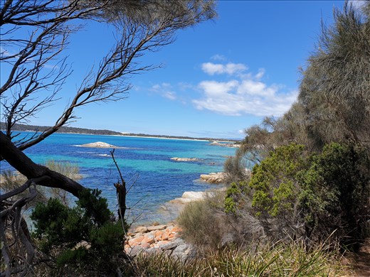 Aquamarine water and red rocks