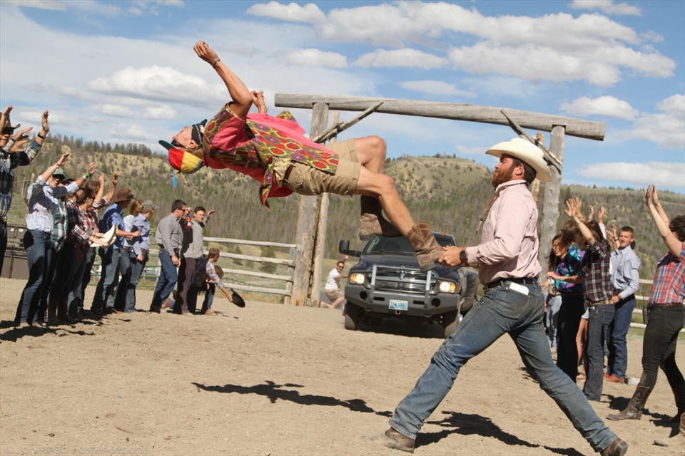 Weekly rodeos at a summer camp in Wyoming feature some incredible stunts. Here, the staff roping team makes their dramatic entrance before facing off against the campers.