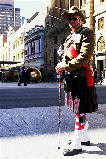 Veteran.
Take your camera with you everywhere; The first lesson. When stumbling across the path of a Vietnam Veteran's march, excitement fills me. Velvia in hand, I set out to find a willing subject for a portrait. Multiple friendly declines later, my view settles upon a lone Veteran preparing towards the back of company. Conversation proceeds; He accepts.