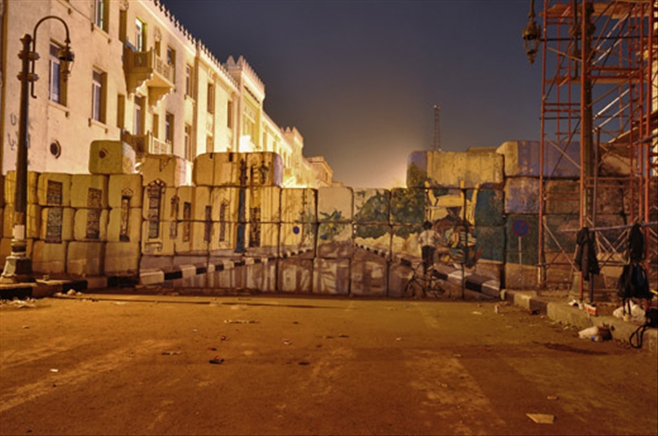 A mural drawn on a wall that blocks entry to Cairo's ministry of interior follow