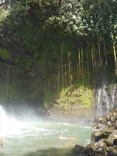 Juanita swimming under Catarata Fortuna. The current was so strong it was hard to get closer to the waterfall.