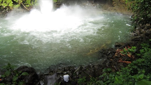 Jorje at the bottom of Catarata Fortuna getting ready for a swim.