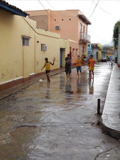 Cuban kids being futbol fanatics. In the street while it's raining, don't even need shoes to play. We did watch The Champions League so it was a big weekend for it.