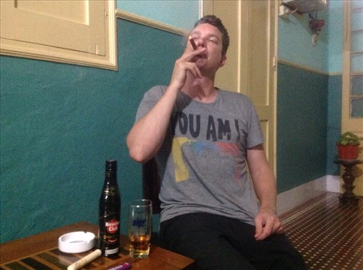 Jorje enjoying a Cuban cigar on our verandah. Smelly.