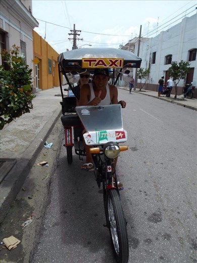 Local transport. Bici-taxi. Very fit drivers, it's hot sun in Cuba.