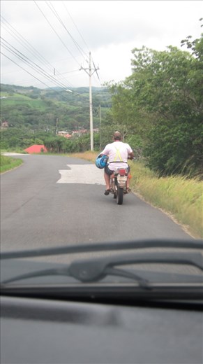 The local drivers annoying Jorje, wearing hi-vis but not the helmet (?!) and not enough room to pass.