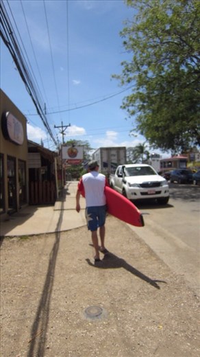 Jorje taking his long board out. It's very heavy, Juanita had to help carry it on the way back, too knackered from surfing all day.