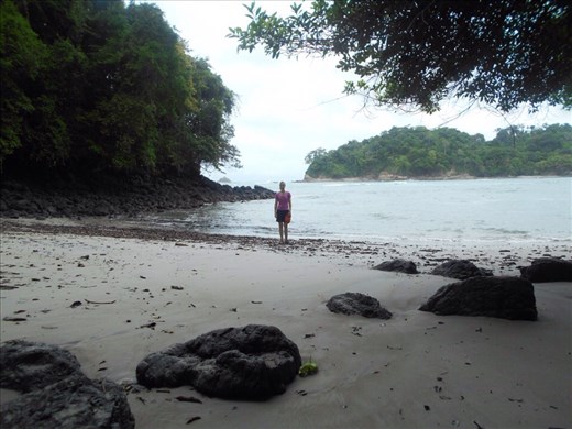 Juanita trying to find a spot to swim on the beach, too many rocks there.