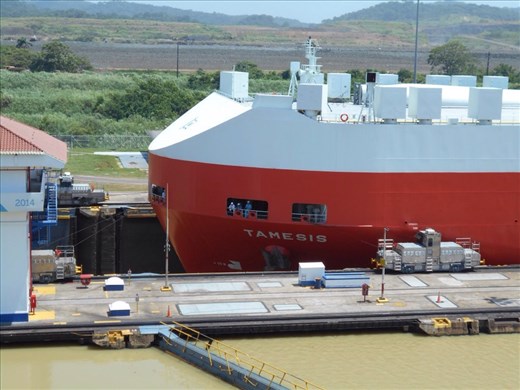 Lock emptied, gates open and the trains pull the ship through to the end of the lock. 