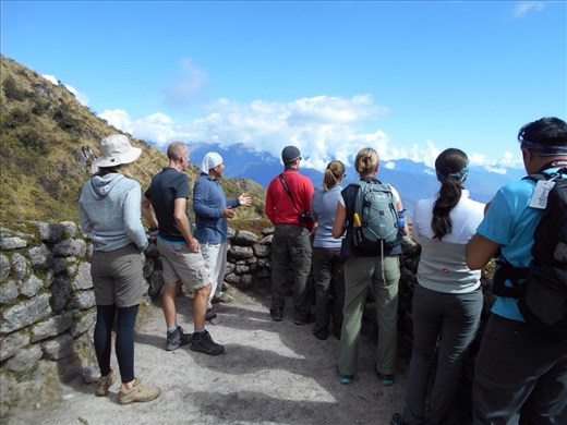 Fernando giving us a history lesson at Phuyupatamarca. We could see Winay Wayna off in the distance