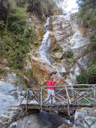Jorje at the Intipata waterfall. The bridge crosses about half way up the falls.