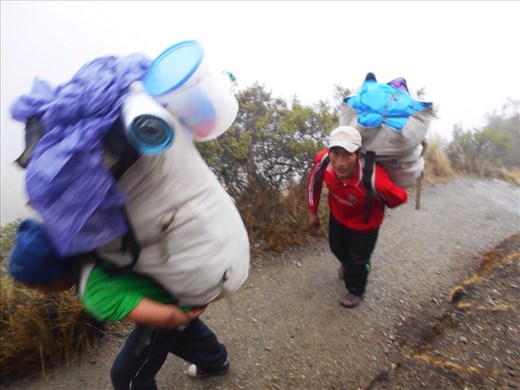Porters carrying huge loads, these guys weren't with our team but its a good example of how they work