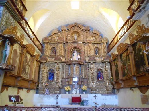 Inside Maca church. All the walls beautifully decorated with plated gold.