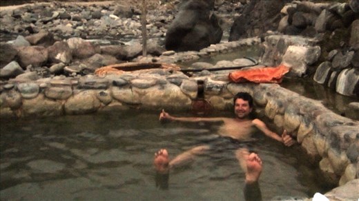Jorje in the natural hot springs. Valley on the way to Colca Canyon.