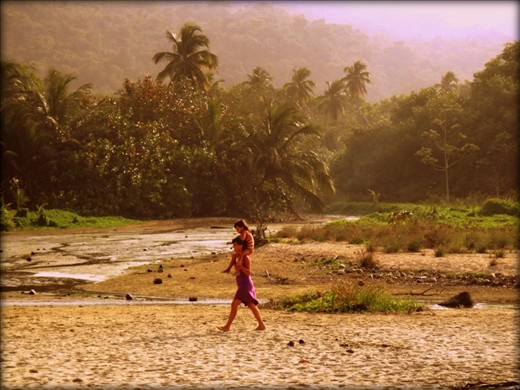 While walking along the beach I noticed this mother and her daughter walking towards me.  I couldn't help but snap a shot.  They looked so happy and carefree.  Tayrona National Park, Colombia