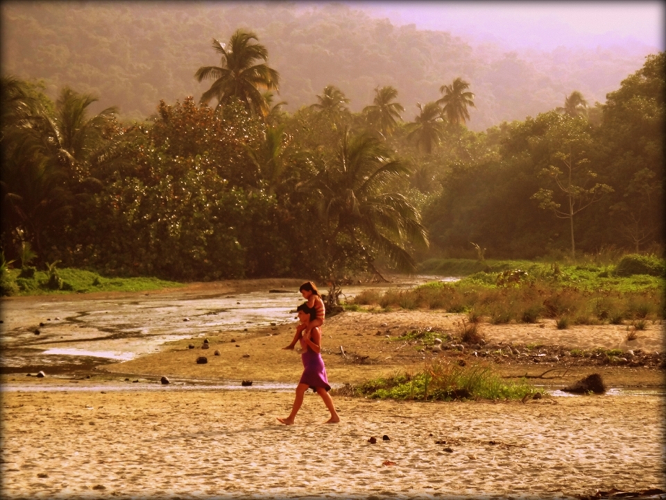 While walking along the beach I noticed this mother and her daughter walking towards me.  I couldn't help but snap a shot.  They looked so happy and carefree.  Tayrona National Park, Colombia