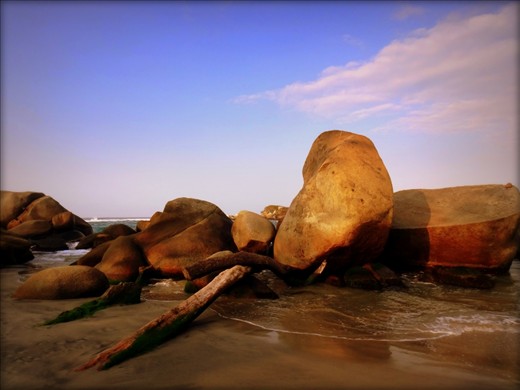 Rocks on the beach, smooth from the ocean waves.  Tayrona National Park, Colombia