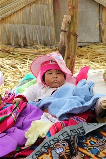 One of the babies at the market on the floating islands
