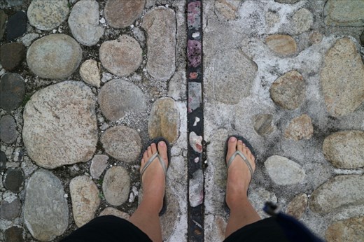 One foot in the Southern hemisphere,  one in the North