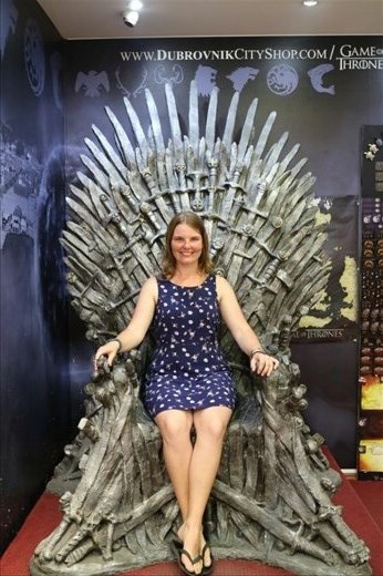 Queen Karen sitting on the Iron Throne