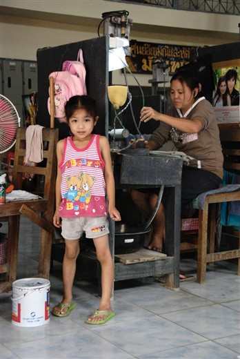A young girl and her mother start work at a Jade factory
