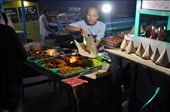 A woman serves up fish and noodles at the Gili Trawangan night market: by josheastwood, Views[712]