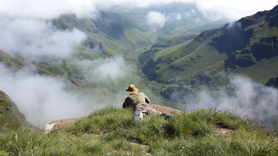 took a quick snap of my brother on our way up grey's pass, Drakensberg. clouds