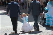A young Sevillan girl follows her uncles to the fair grounds. Even the youngest wear classic flamenco dresses to celebrate the festival which dates back to 1847. Fería started as a livestock fair, but eventually transformed into the spectacular celebration that can be seen today.: by josiehogg, Views[327]