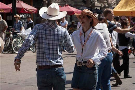 Dancing couple in the streets of Calgary during The Calgary Stampede