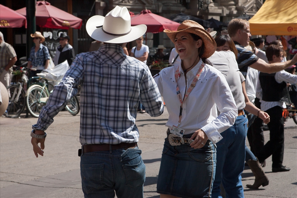 Dancing couple in the streets of Calgary during The Calgary Stampede