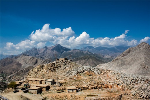 Traditional mud-houses on the naturally abundant mountains of FATA. One of the peaks, storing marble deposits, clearly shows a mud-house (at the top), attacked and destroyed due to militancy.  