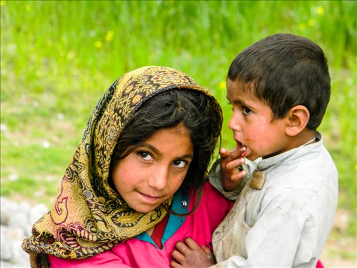 One day I will teach the art of responsible parenting. 
(Wrapped in a beautiful traditional chaddar/shawl a beautiful girl taking good care of her younger sibling)