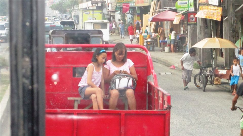 One busy day inside a crowded bus going to the place I was planning to visit, I can’t help but capture this rare moment. While everyone on the road is looking forward to get to their destinations, these two are busy with their own business and doesn’t seem to care about the world. Surrounded by endless motion and them as the focal point reminds me of Madonna and Child’s portrait.