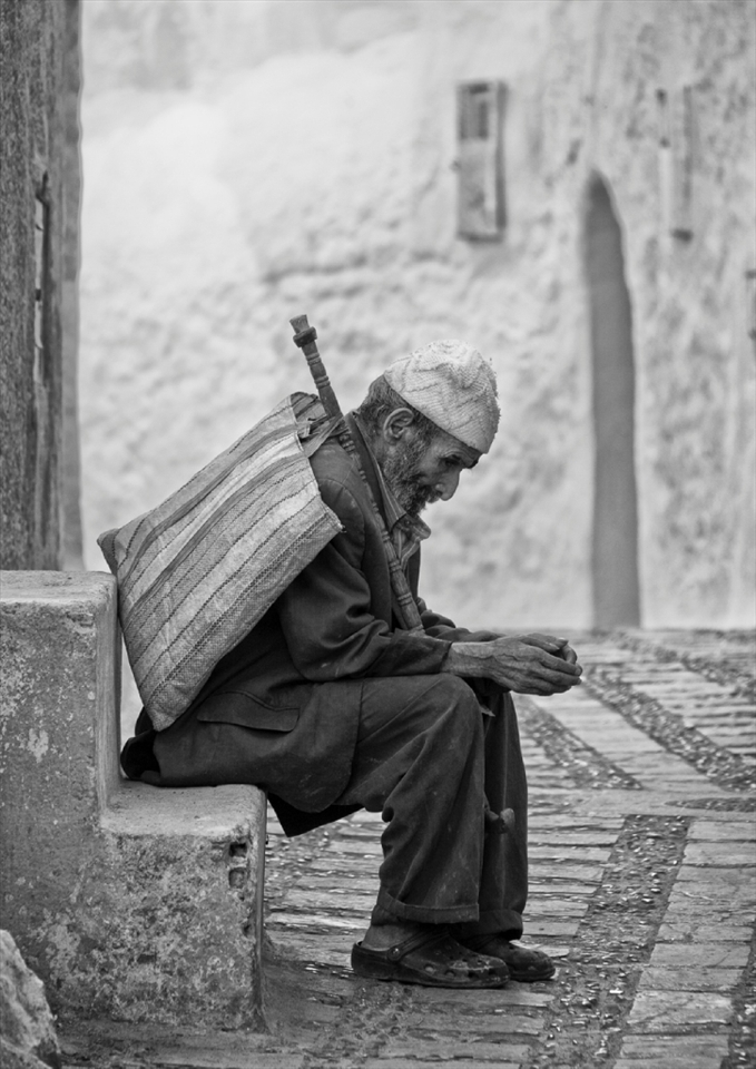 It is not uncommon to see beggars on street corners in Morocco.  This particular Moroccan
Beggar, dressed in a weathered old suit, had a quiet dignity about him.  He was aware of my presence yet did not ask for anything.   “Allah Yasahel” – May God improve your situation.
