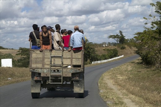 Here we can see locals travelling on a crowded camion particular. They may have waited hours for this ride. The truth is Cuba’s transportation was dramatically changed with the dissolution of the Soviet Union. The so called ‘Special Period’ that followed was defined by severe shortages in energy resources in the form of gasoline, diesel and other petroleum products.  One of Cuba’s innovations during the ‘Special Period’ was to sanction hitchhiking; as a result certain vehicles were obliged to carry passengers. 