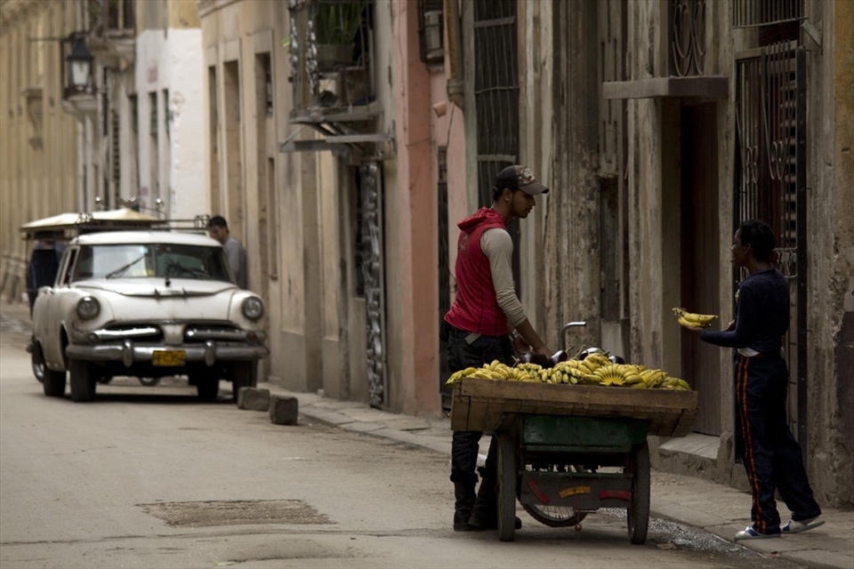 Here we can see a street vendor selling fresh produce. Cuba is a country where rationing and food shortages are the norm. The introduction of organic and sustainable agriculture was another outcome of the ‘Special Period’. It revolutionised Cuba’s food industry and resulted in the adoption of a locally grown diet which is 
low on meat but high in wholegrain foods, fruits and vegetables.
