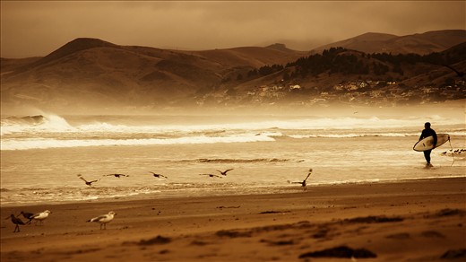 Morrow Bay, CA
Shot on a cloudy day on Morro Beach.  There was only a few people around including a lone surfer.