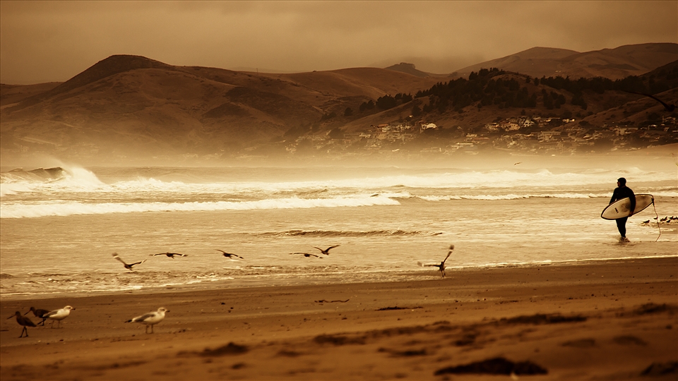 Morrow Bay, CA
Shot on a cloudy day on Morro Beach.  There was only a few people around including a lone surfer.