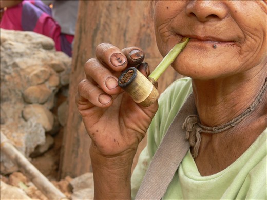 Content. Fingers charred from work and pleasure tell of a simple and honest farming life