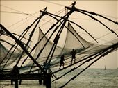 As the sun sets, two fishermen pull in the ropes after an unsuccessful day. 
The Chinese fishing nets (Cheena Vala) decorate the coastline of Fort Cochin, India, and have been used for hundreds of years to catch dinner for locals and the many tourists who flock the area.
: by jsan, Views[322]