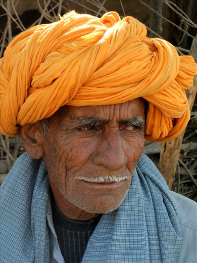 Ajab doesn’t speak English, but his son Nindi tells me that he has spent his entire life in the small town Thikarda, India, which is known for its pottery.  His character lines represent the full life of someone who has known the struggle and joy of life with seven children.