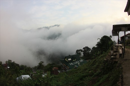 beautiful locations always call to tourists, and tourists will always needs lodgings and accommodations, even in the most rural areas.  The inn is one of many that have sprung up to accommodate tourists on the steep mountainside.  But it has allowed the community to develop from basic huts made of wood to houses and buildings of concrete and steel.