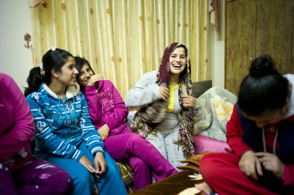 Muslim friends tease a girl for wearing her headscarf 
